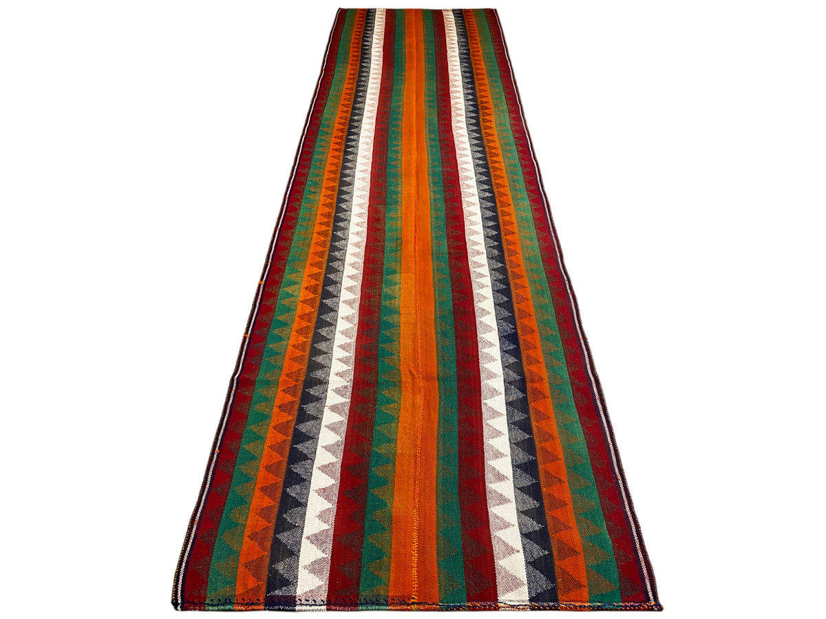 Jajim runner rug from the front: multicolored stripes with zigzags, bound edges