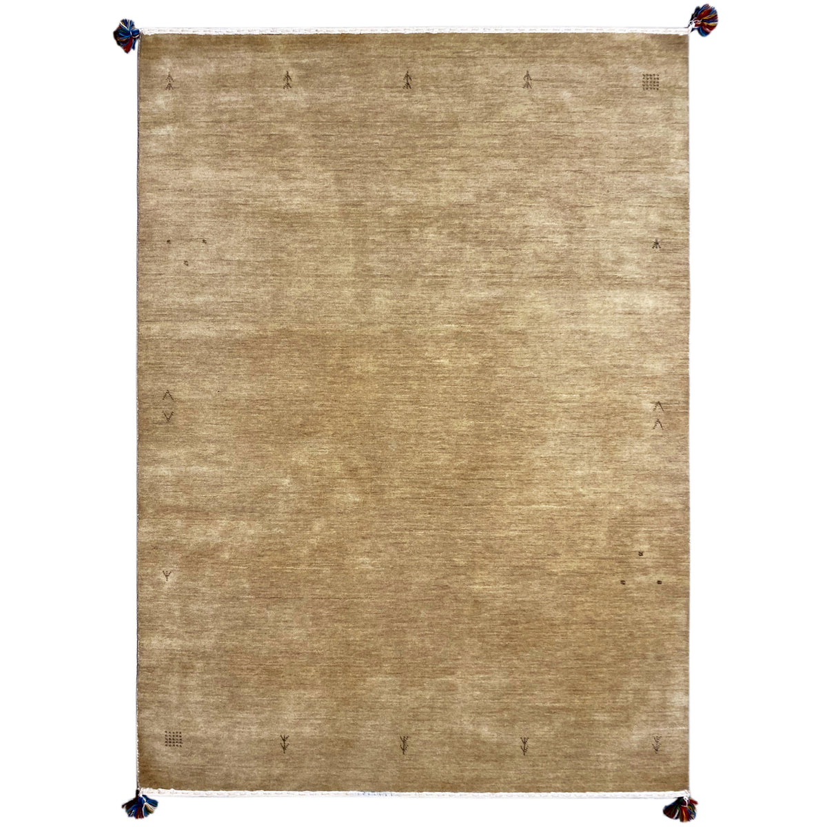 Light brown Gabbeh rug with a fine texture and blue tassel trim at the corners