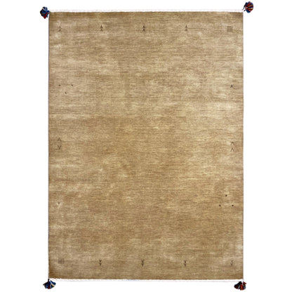 Light brown Gabbeh rug with a fine texture and blue tassel trim at the corners