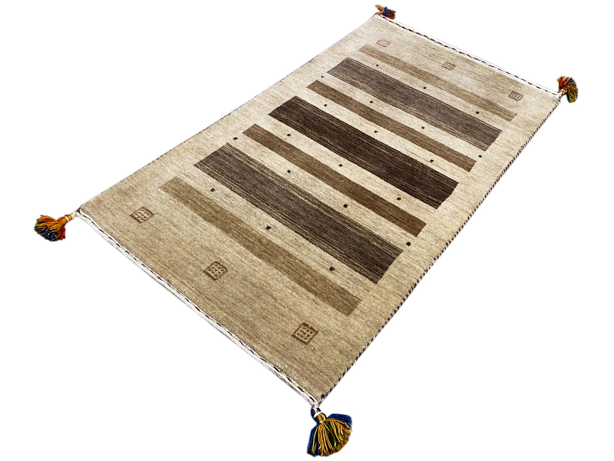 Gabbeh rug with a beige background, wide dark stripes, and corner fringes, 120×68 cm