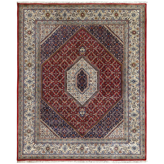 Bidjar rug with a red medallion and blue-and-white ornaments in the border frame