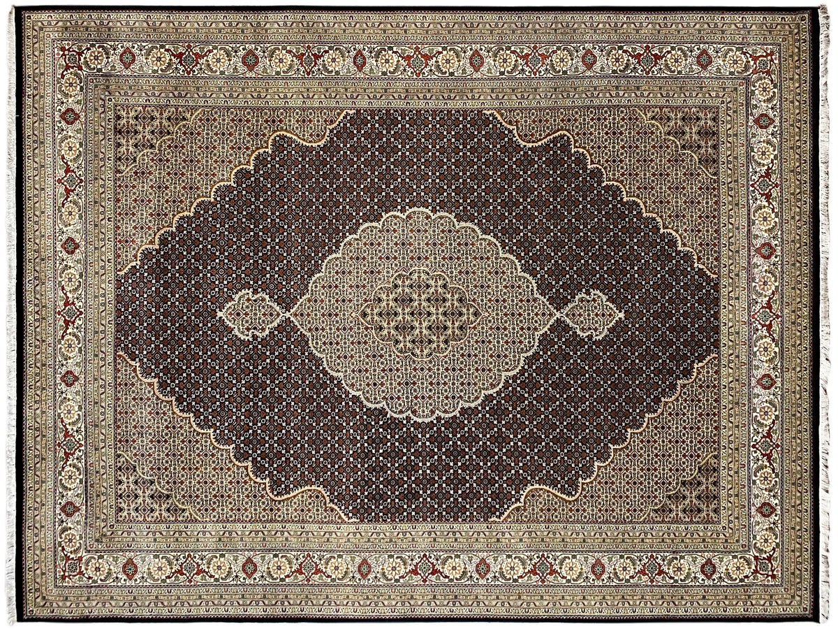 Rectangular rug with a dark field and a central light medallion, surrounded by a border