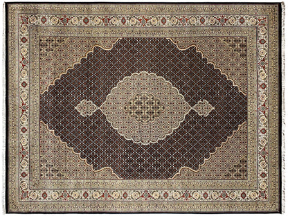 Rectangular rug with a dark field and a central light medallion, surrounded by a border