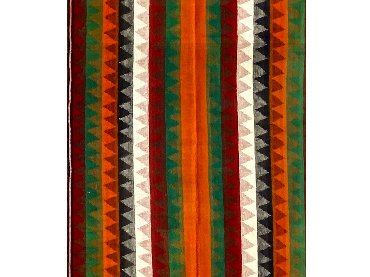 Jajim runner rug close-up: vertical stripes in green, orange, red, and white