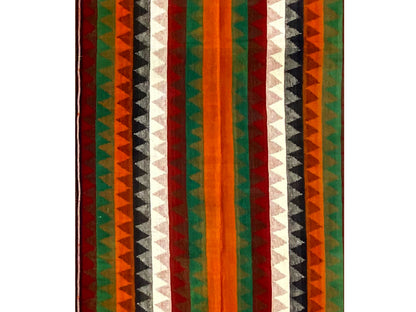 Jajim runner rug close-up: vertical stripes in green, orange, red, and white