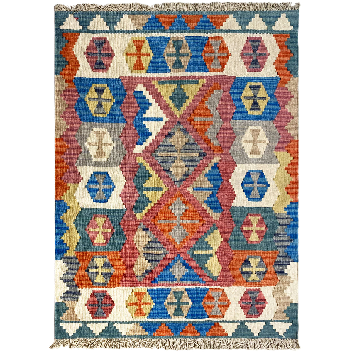 Qashqai rug with a colorful ornamental pattern, blue background, and fringes