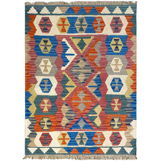 Qashqai rug with a colorful ornamental pattern, blue background, and fringes
