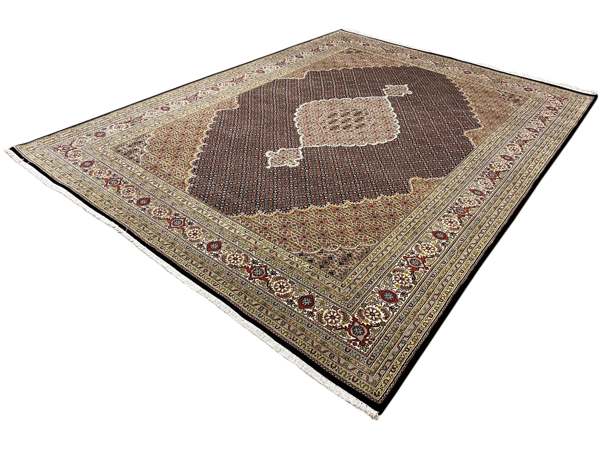 Oriental rug with a dark medallion, beige patterns, and a decorative border motif