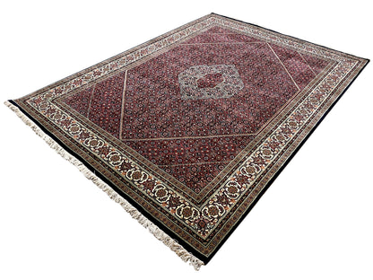 Bidjar rug, red pattern with central medallion, side border and fringes, laid diagonally