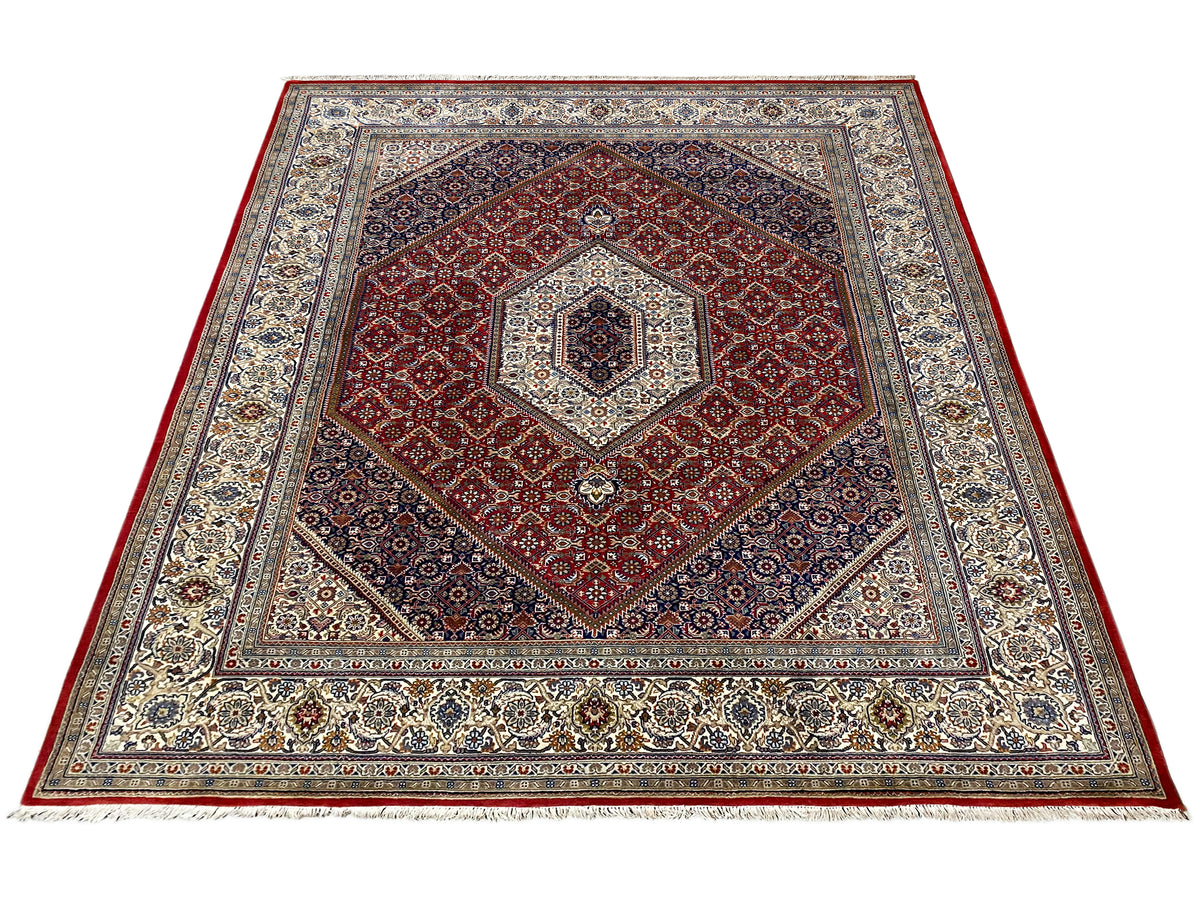 Rug with a red heart/medallion motif and multicolored ornamental borders