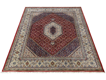 Rug with a red heart/medallion motif and multicolored ornamental borders