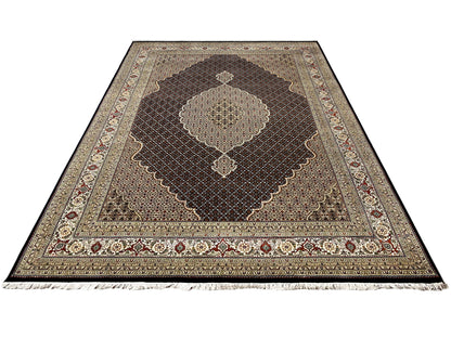 Rectangular rug with a brown background, medallion design, and fringe on the sides