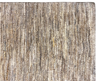 Gabbeh rug, close-up: mottled beige-gray striped texture and short pile