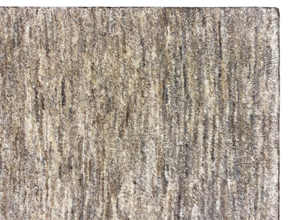 Close-up of the surface: Gabbeh rug with beige, gray, and brown threads
