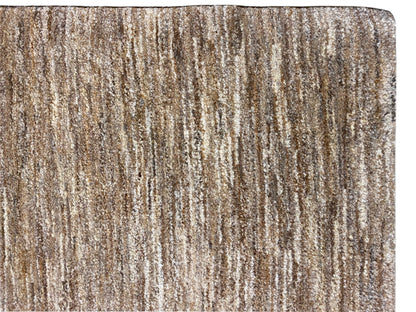 Close-up of a Gabbeh rug: brown-beige pile with fine vertical stripes