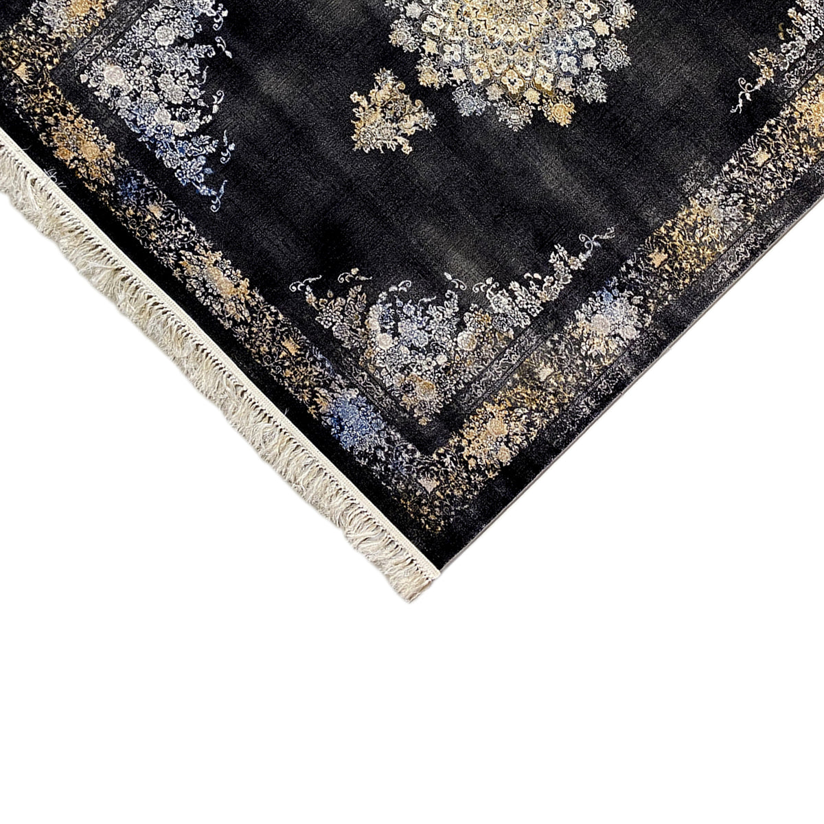 Corner area black carpet with gold and cream ornament, fringe