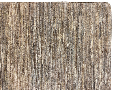 Close-up: 243x168 rug with a dense, mottled gray-brown texture at the edge.