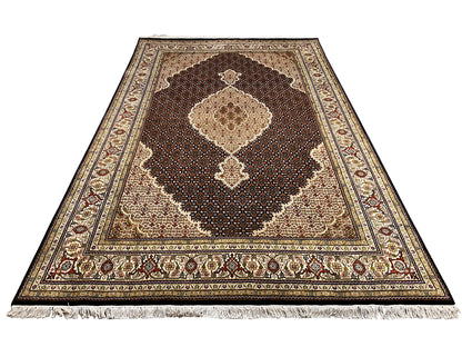 Brown Indo-Tabriz rug with a large medallion and ornamental border, brown/beige