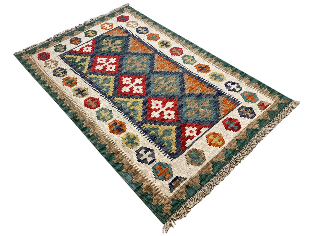Kilim rug with diagonal diamonds and colorful symbols, with fringes