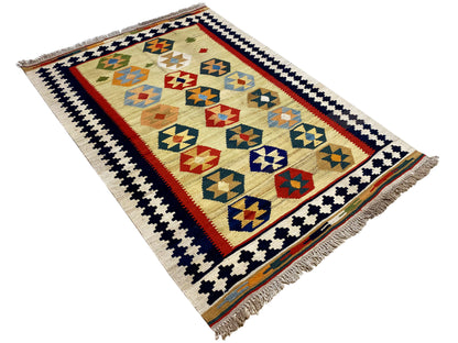 Kelim-Qashqai rug in beige with a geometric center, decorative stripes, and fringes