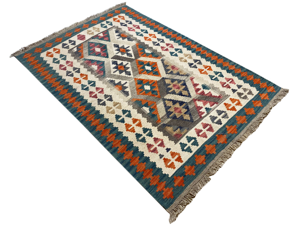 Kilim rug with diagonal perspective, cream base, orange-blue patterns, fringes