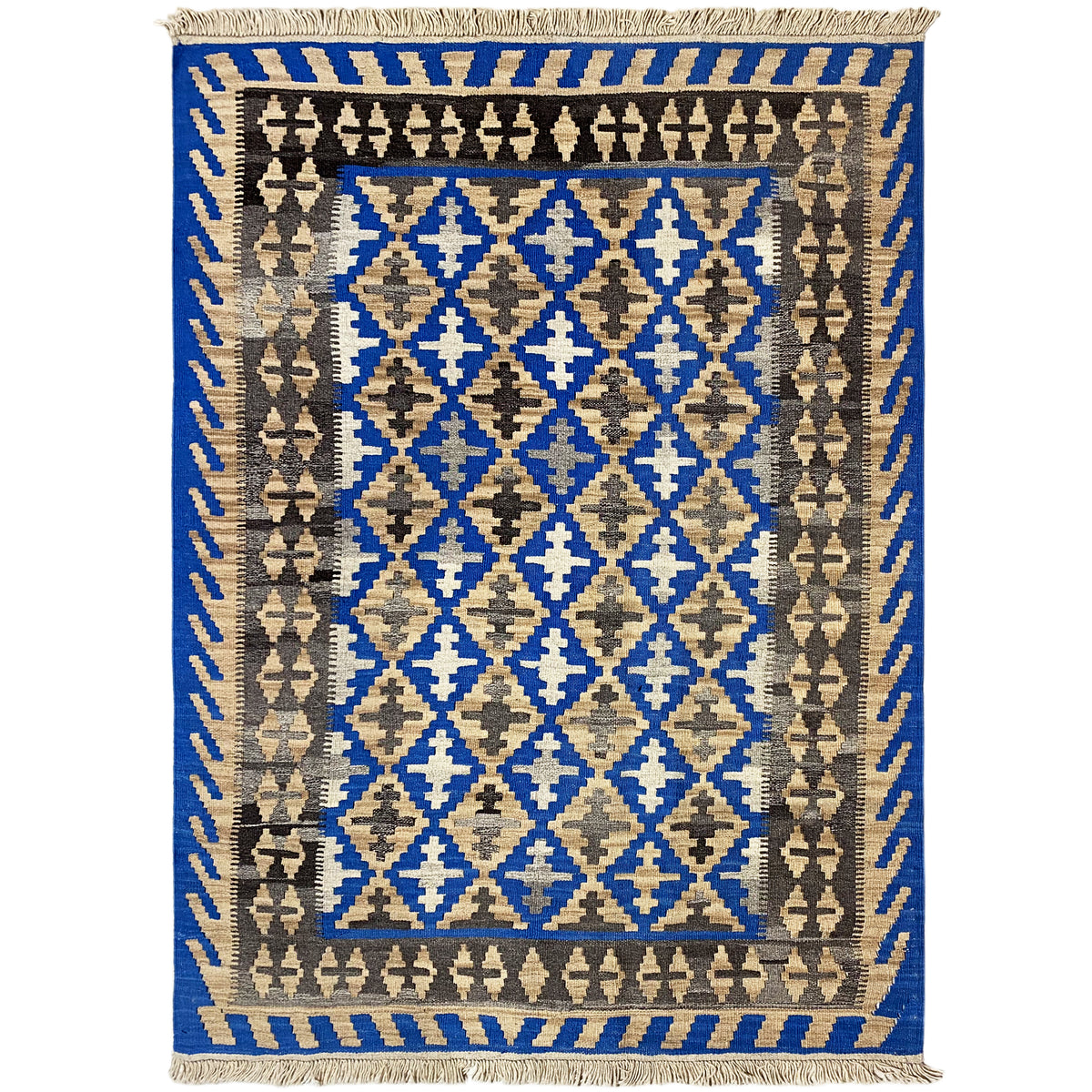 Kilim rug with a blue central field, beige and brown diamond patterns, and fringes