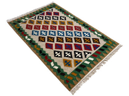 Kelim-Qashqai rug 147x95 cm, lying at an angle with a colorful diamond pattern and fringes