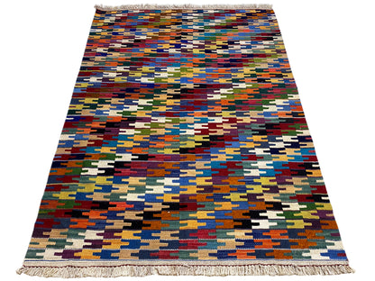 Flat-woven Kelim Qashqai rug with a colorful grid pattern and fringes all around