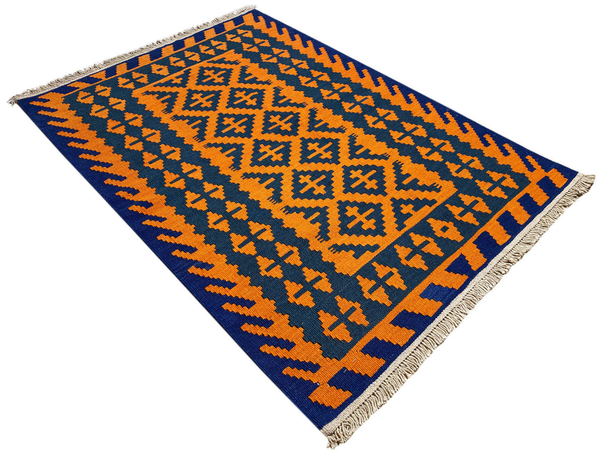 Kilim rug with fine zigzag and cross patterns in orange and dark blue, fringes