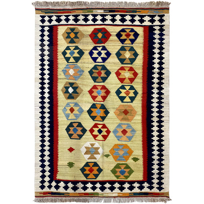 Beige kilim Qashqai rug with multicolored diamond pattern and fringes along the bottom edge