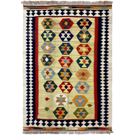 Beige kilim Qashqai rug with multicolored diamond pattern and fringes along the bottom edge