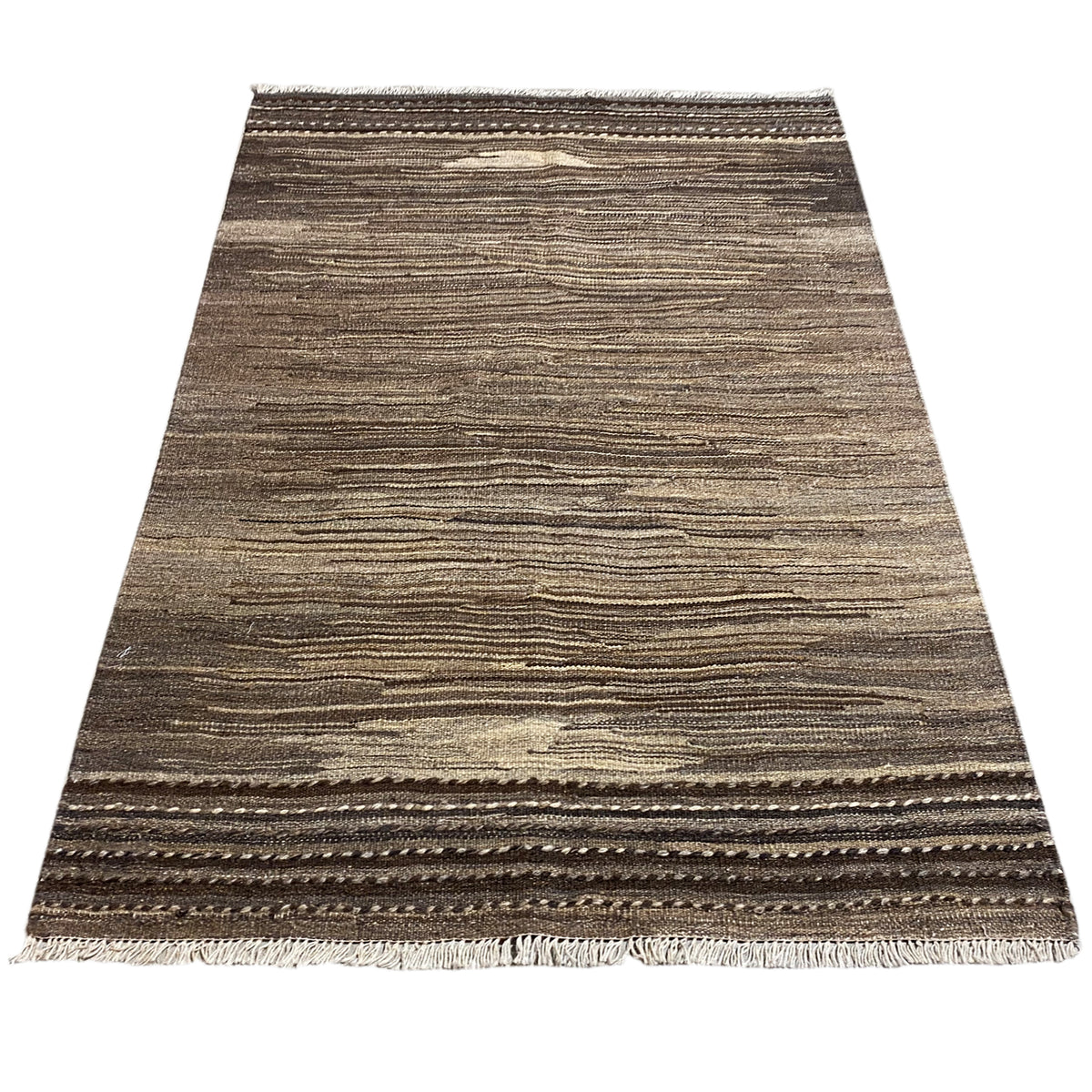 Brown and beige kilim rug with a border around the edges and fringes
