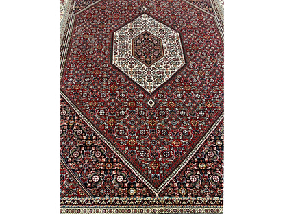 View of the red carpet with a central medallion and diagonal ornamental frames