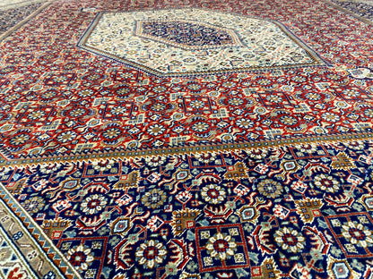 Bidjar rug with a red background and colorful floral and diamond pattern, large-scale details