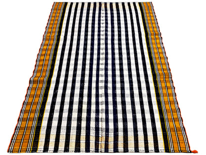 Rectangular Jajim rug with a black-and-white striped grid and yellow-orange border edge