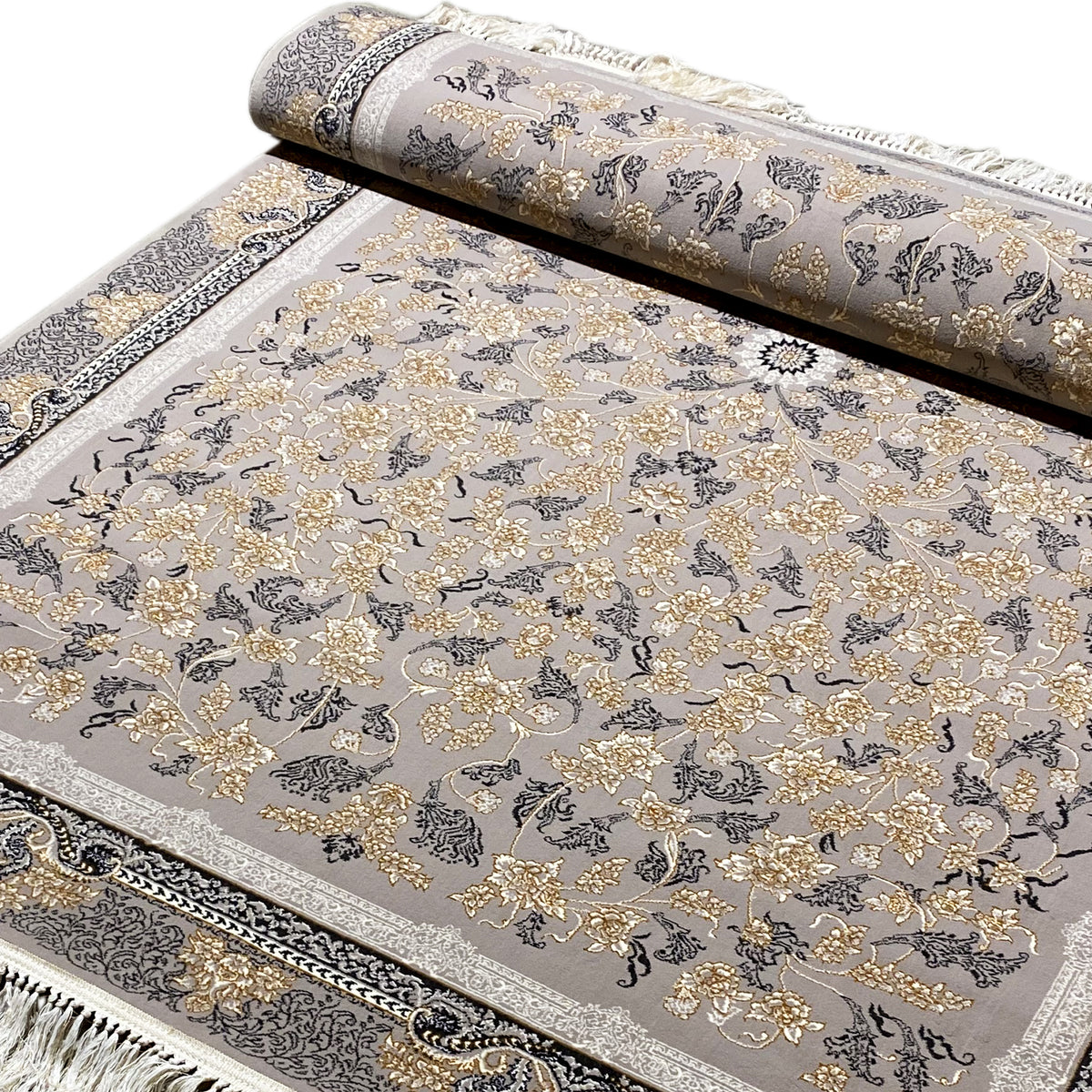 Rolled-up carpet, gray background with golden floral ornaments and a dark border