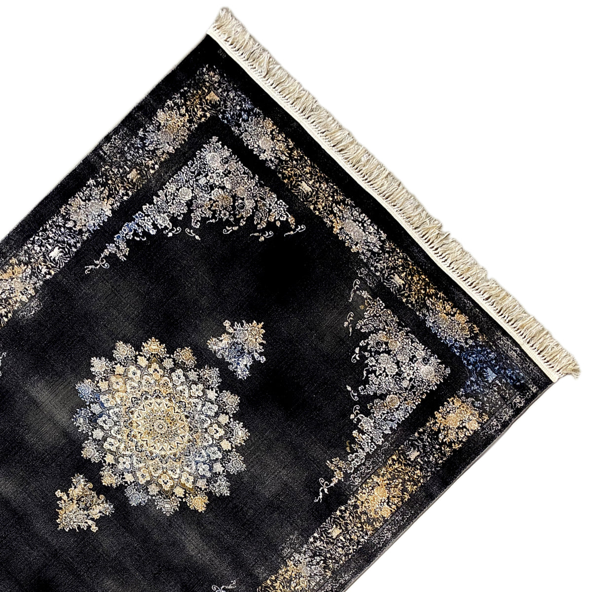 Rug detail: dark geometric-patterned rug with gold and silver designs, fringes