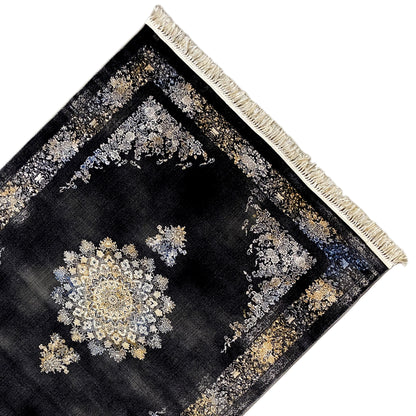 Rug detail: dark geometric-patterned rug with gold and silver designs, fringes