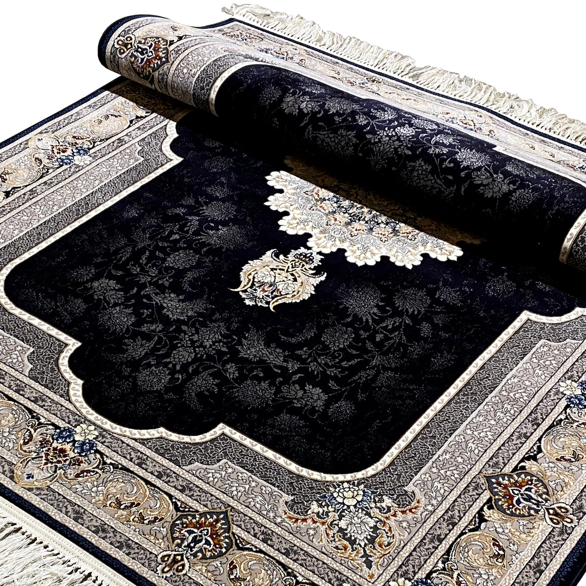 Folded carpet view: black surface with a medallion and floral motifs, cream-colored border