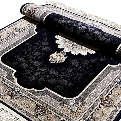 Folded carpet view: black surface with a medallion and floral motifs, cream-colored border