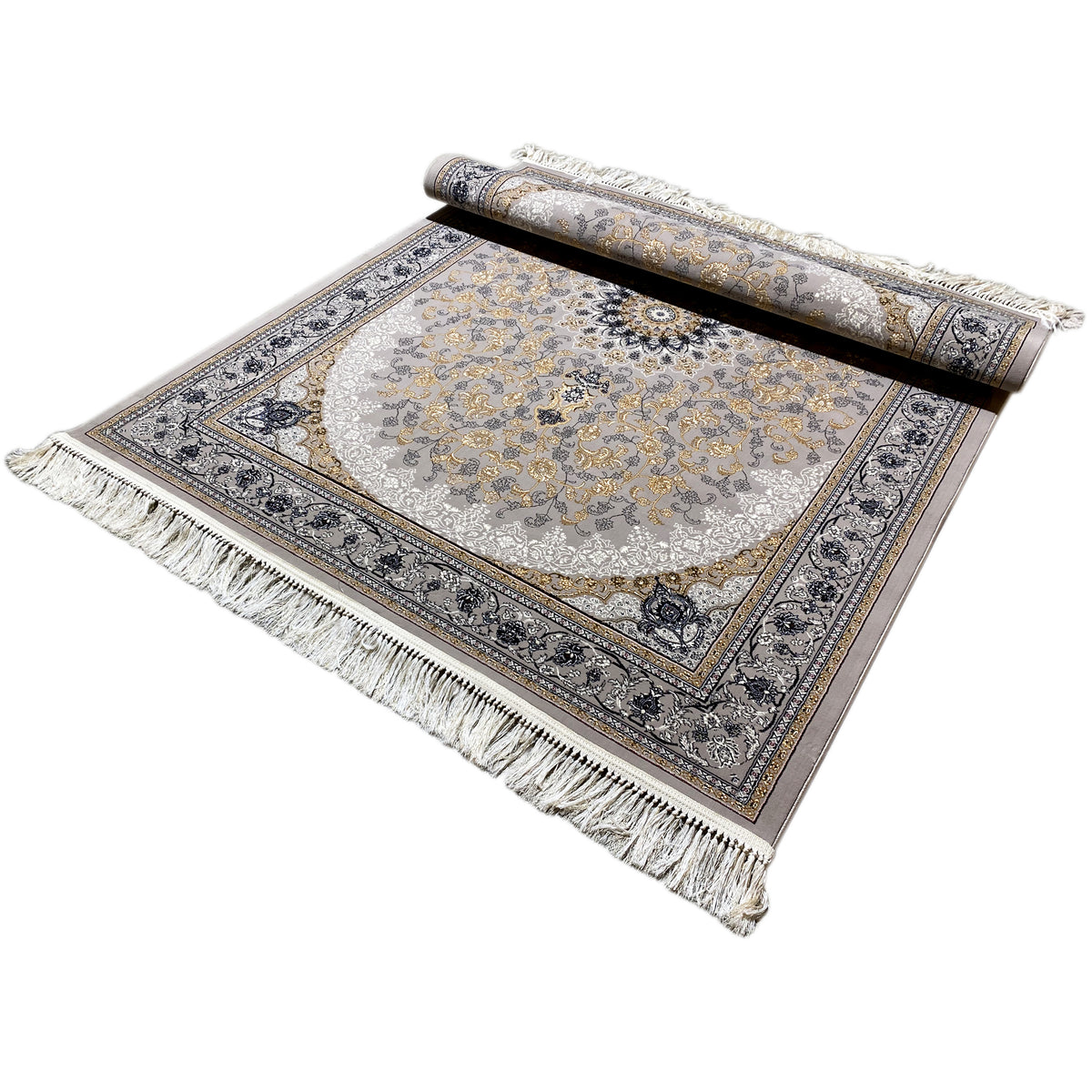 Medallion rug laid flat with a rolled-up section at the top, fringes along the edges