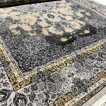 Rug detail: dark medallion, floral ornaments, golden accents, fringed edge