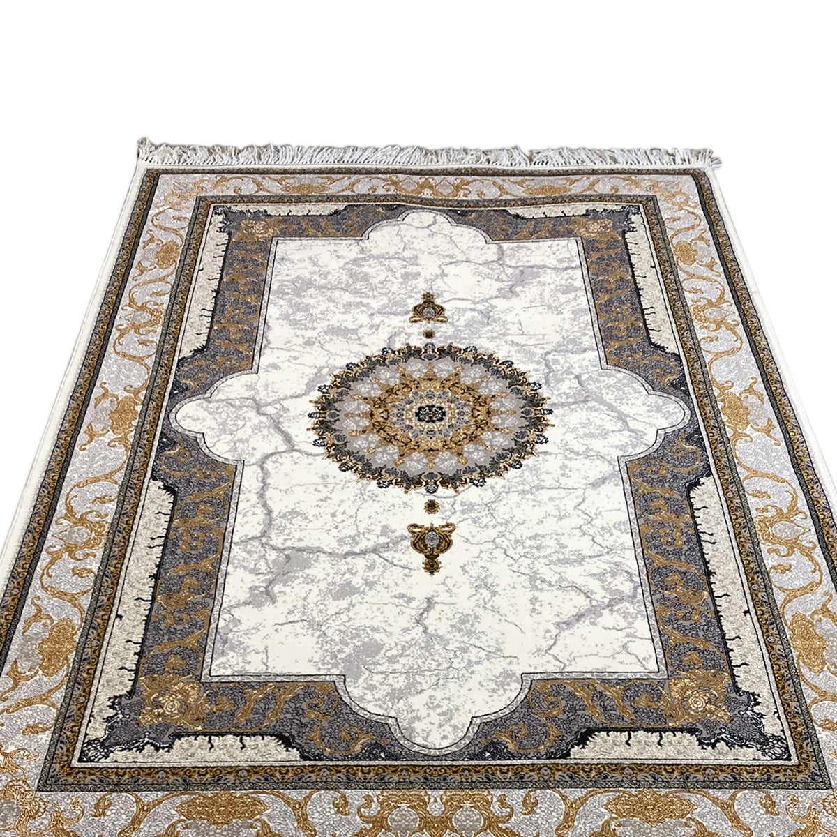 Top view of the rug: light medallion, dark inner border, golden patterns, and fringes.