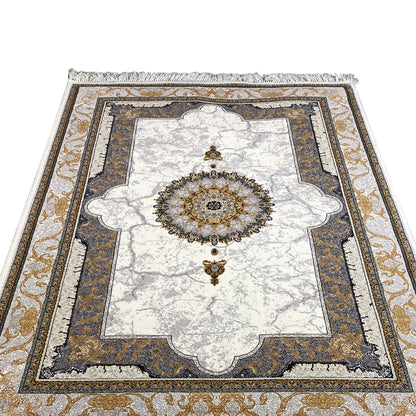 Top view of the rug: light medallion, dark inner border, golden patterns, and fringes.