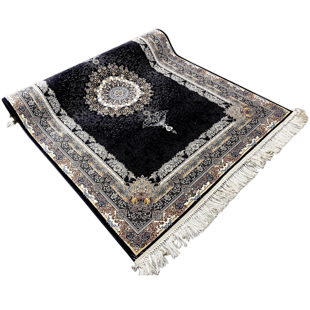 Black carpet viewed from above: medallion pattern, surrounding decorative border, and fringes at the corners