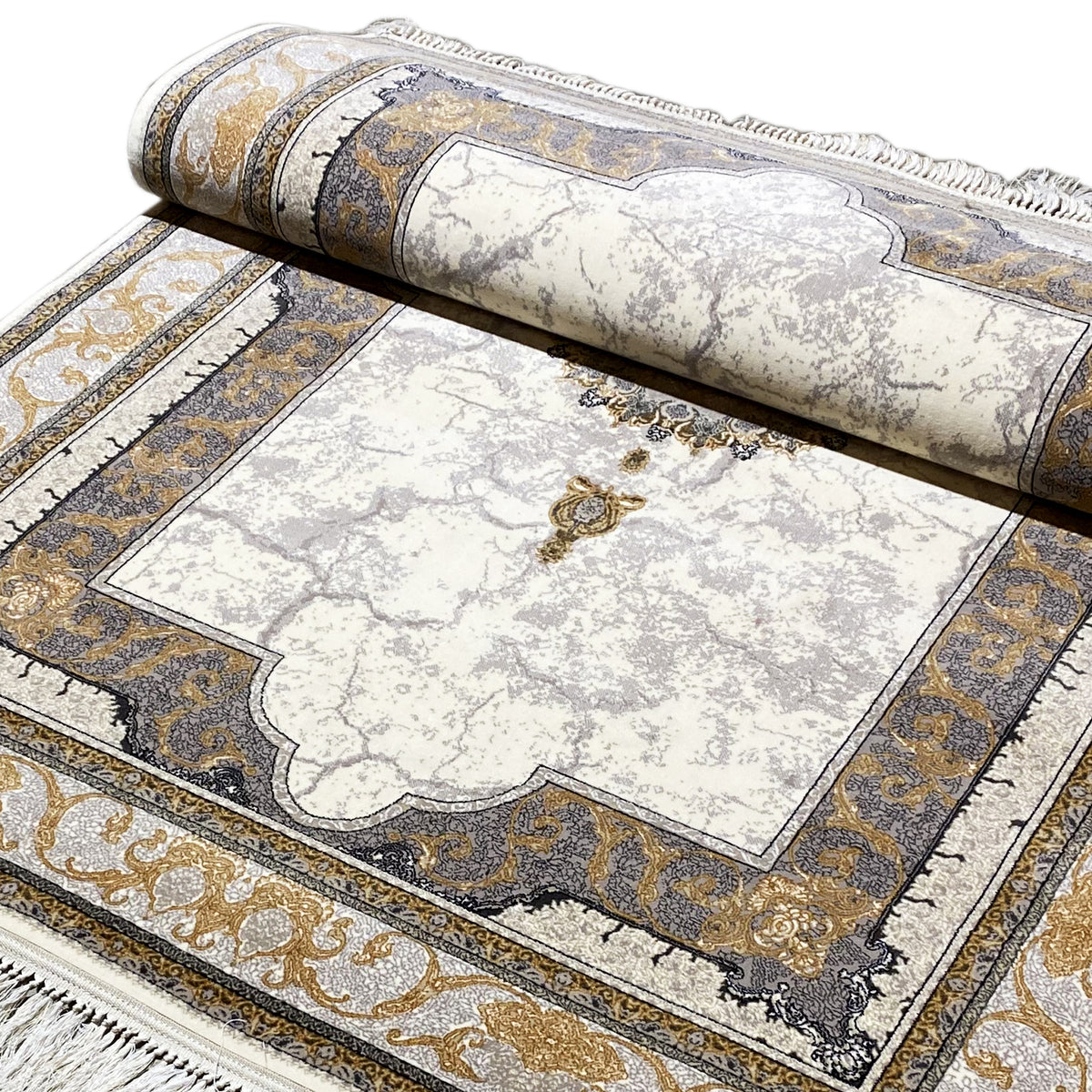 Rug detail: bordered cream-colored area with gold accents and fringe trim.