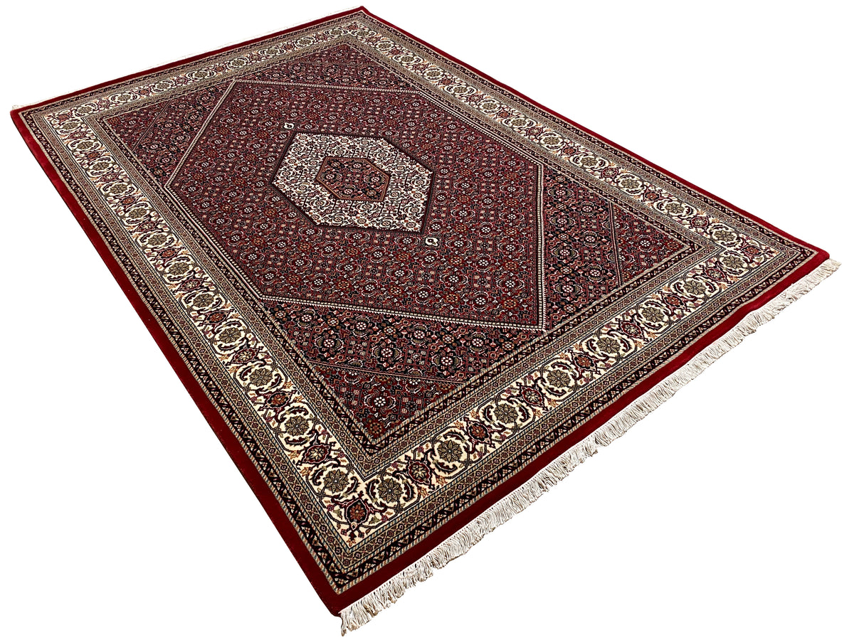 Rug 244x170 cm, angled from above: red pattern in a medallion frame
