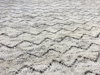 Berber rug close-up: light beige texture with gray zigzag lines