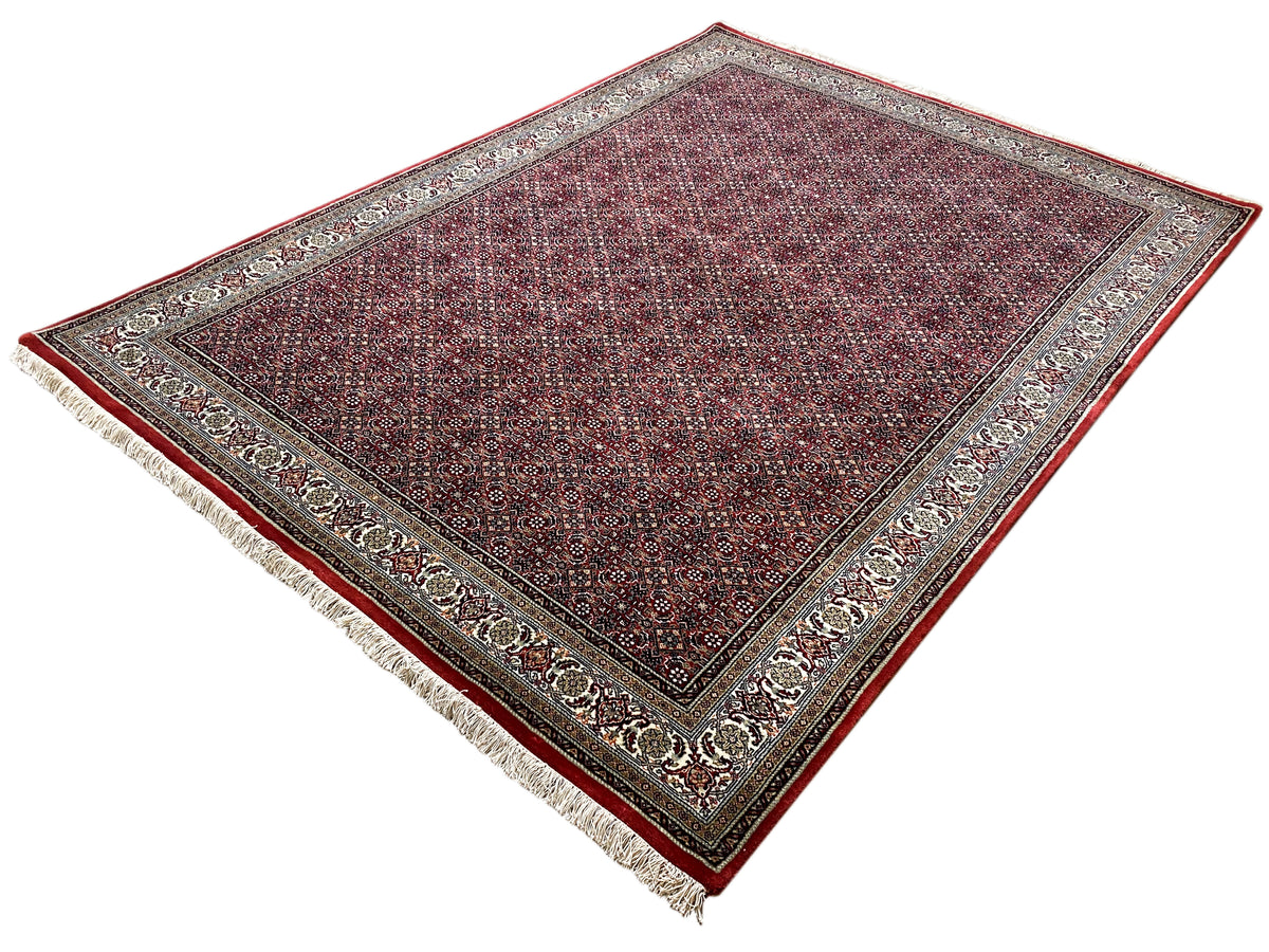 Bidjar rug diagonal view, dark red pattern with cream-colored ornamental borders