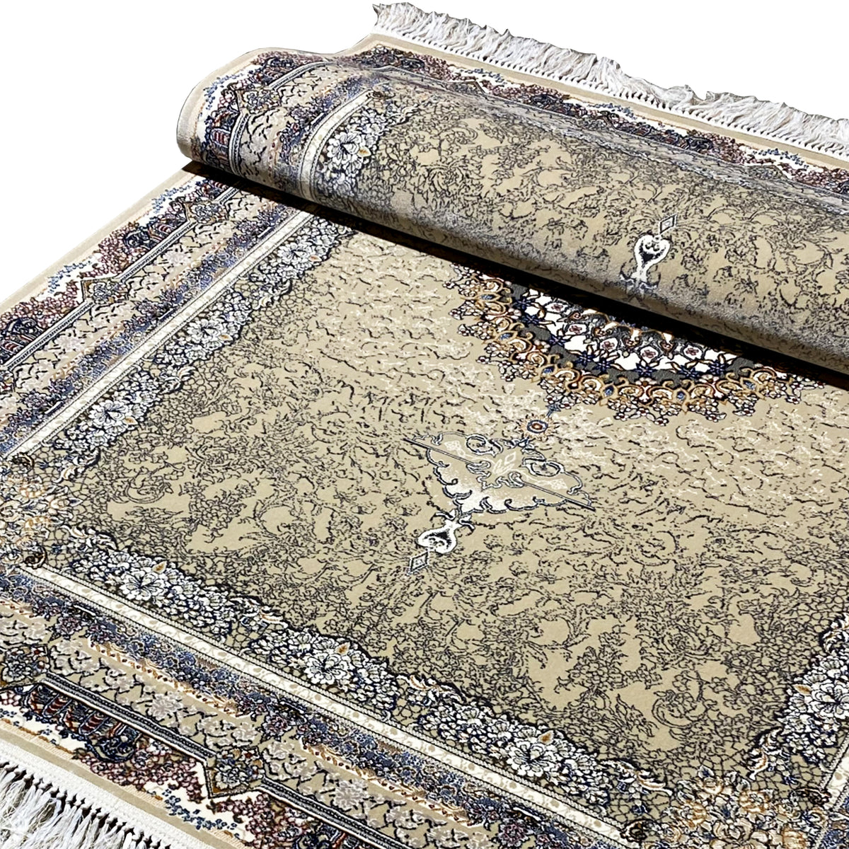 Close-up of a rolled carpet edge: beige ornamental design with a dark blue border and fringes